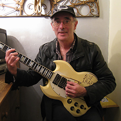 Barry Monks with Ollie's guitar